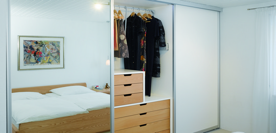 A wardrobe for utilising all available space.